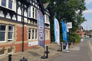 CRYONiQ showroom seen from street with banners with cryotherapy chamber for sale in UK Manchester